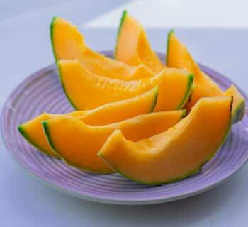 sliced fruit on white ceramic plate